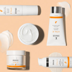 Four IMAGE Skincare VITAL C hydrating water burst | IMAGE Skincare products arranged on a peach background with visible creamy textures and smooth gel swatches for skincare and hydration.