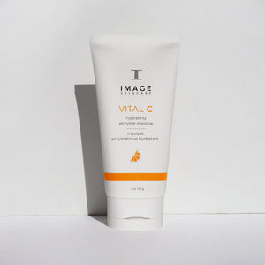 Tube of VITAL C hydrating enzyme masque | IMAGE Skincare with white and orange packaging standing upright against a plain white background, casting a soft shadow.