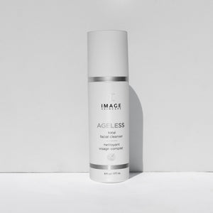 Bottle of AGELESS total facial cleanser | IMAGE Skincare, a white skincare product container with silver accents designed for a complete facial cleansing routine.