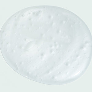 Close-up of a smooth, creamy white gel texture sample representing AGLESS total facial cleanser | IMAGE Skincare for effective skincare and gentle cleansing.