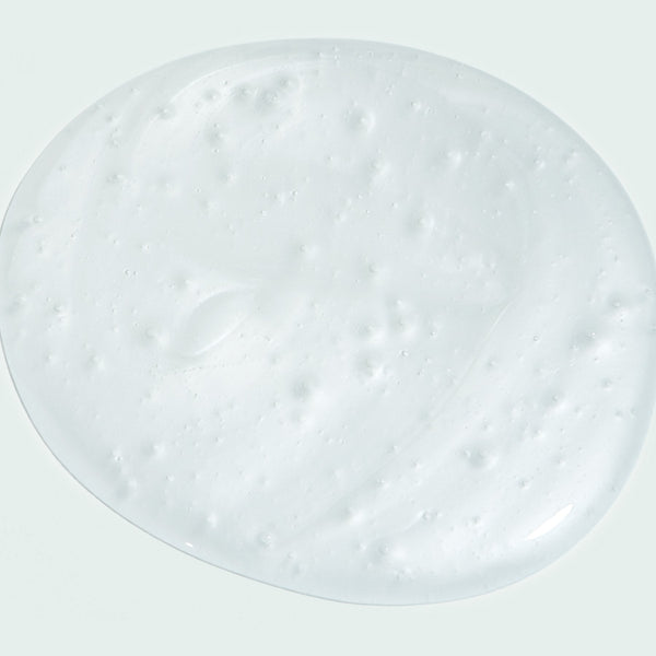 Close-up of a smooth, creamy white gel texture sample representing AGLESS total facial cleanser | IMAGE Skincare for effective skincare and gentle cleansing.