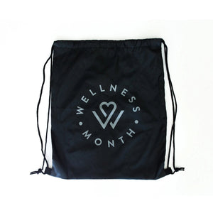 Black polyester drawstring bag featuring a minimalist circular Wellness Month logo with a heart and stylized letters, designed for convenient wellness and body care storage.