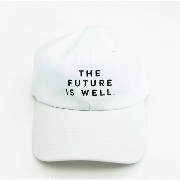White dad hat with black embroidered text "THE FUTURE IS WELL." front centered, featuring the product title Wellness Month Dad Hat - Future is Well - White | Wellness Month