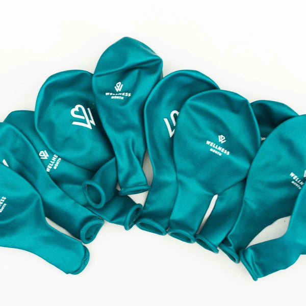 A group of teal-colored Wellness Month Logo Balloon | Wellness Month balloons arranged on a white background, each featuring a white wellness-themed logo.