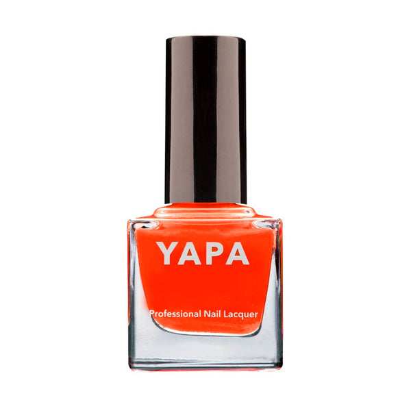 Bright orange professional nail lacquer bottle with black cap labeled YAPA, showcasing the Tamra Nail Lacquer | YAPA for vibrant nail color.