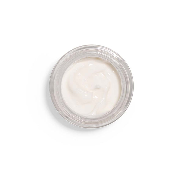 Top view of creamy white texture in a jar of Three Milk Ageless Sleep Cream with Peptides | Farmhouse Fresh, a skincare product designed for overnight hydration and renewal.